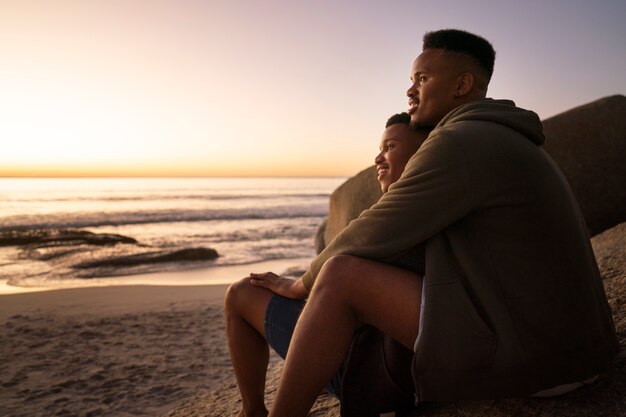 Gay male couple on the beach