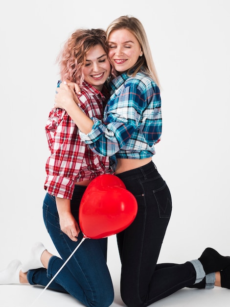 Free photo gay women posing happily for valentines