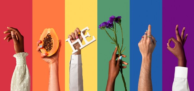 Gender fluid people hands on rainbow background