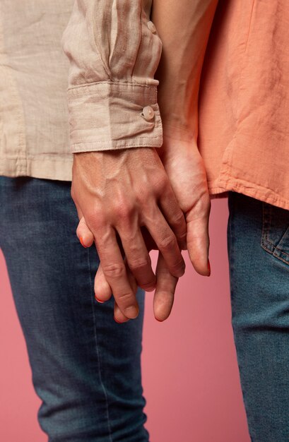 Gender fluid people holding hands