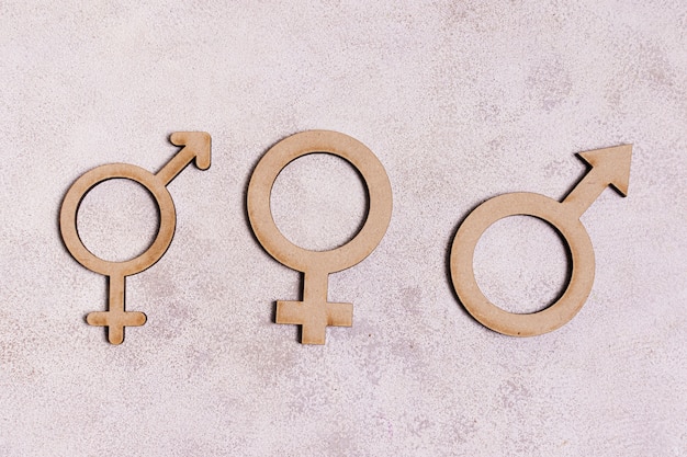 Gender signs on marble background