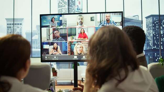 Free Photo general manager starts a meeting on online videoconference call in the boardroom