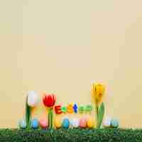 Free photo gentle flowers with eggs for easter