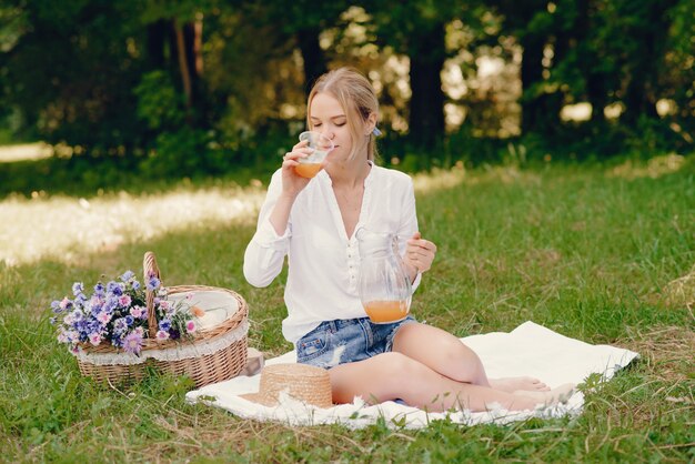 gentle girl sitting in a park