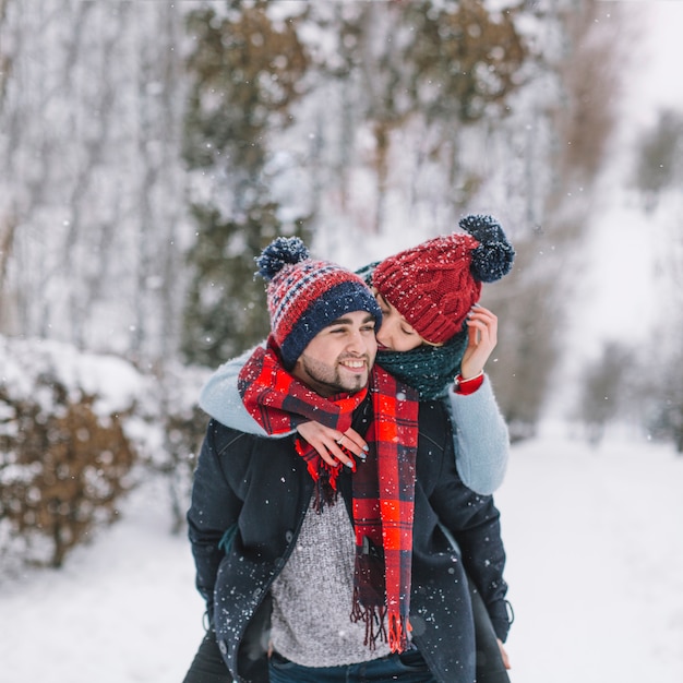 Gentle young couple having fun in woods