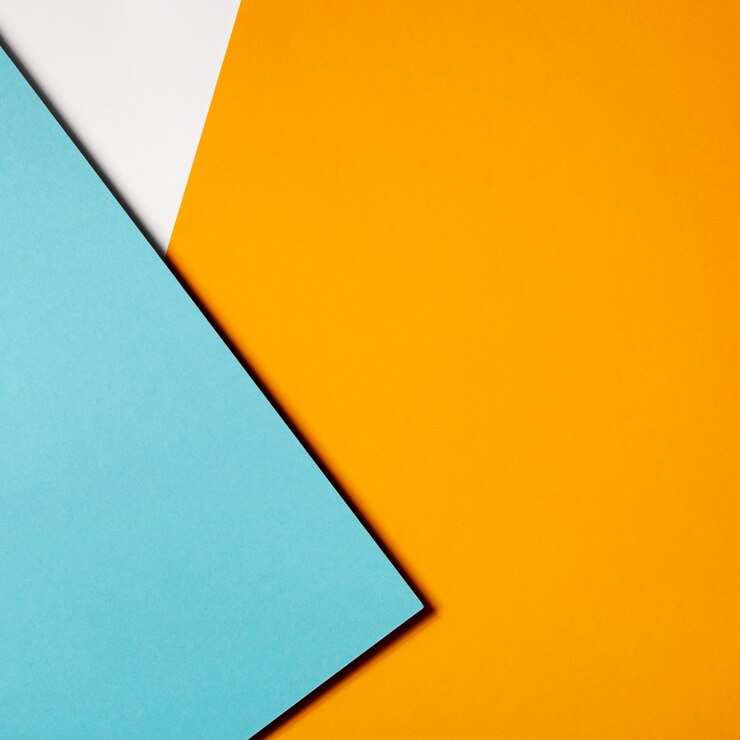 Free Photo geometric composition made with blue and yellow cardboard