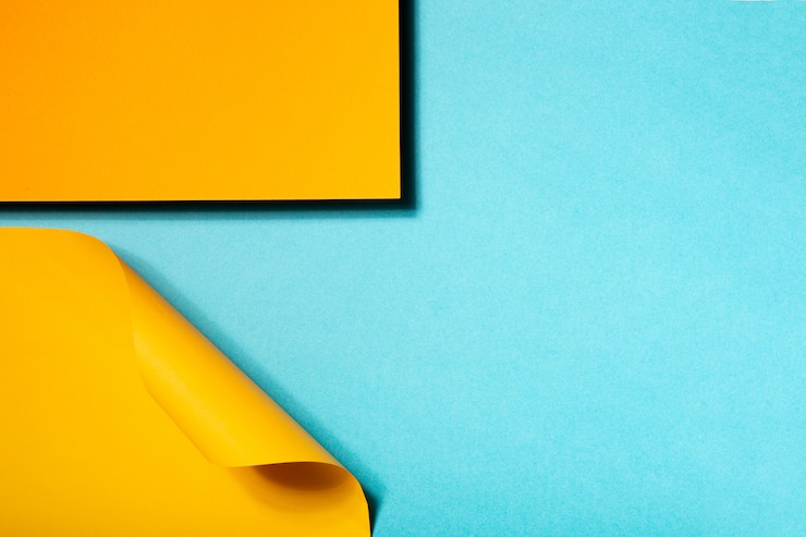 Free Photo geometric composition made with blue and yellow cardboard