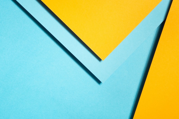 geometric composition made with blue and yellow cardboard