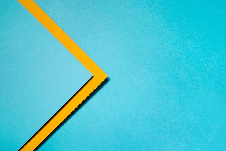 Free Photo geometric composition made with blue and yellow cardboard