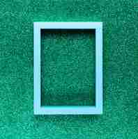 Free photo geometric frame on green background