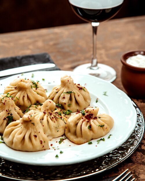 Georgian khinkali sprinkled with herbs and sumach