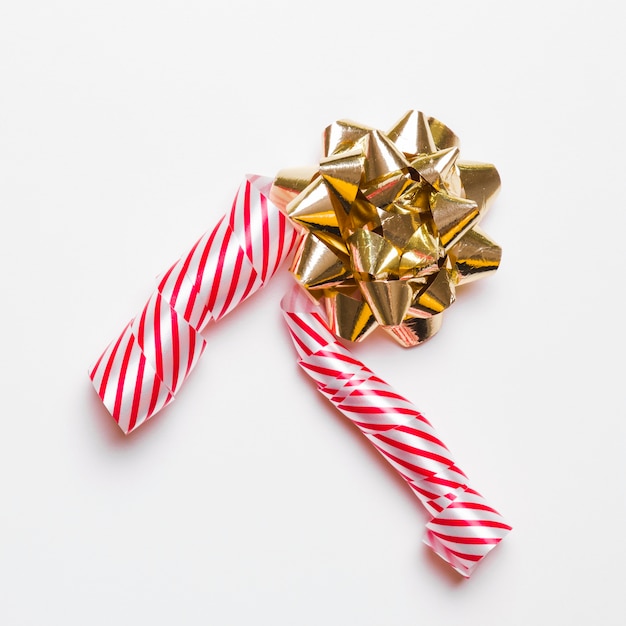 Gift bow with ribbon on table