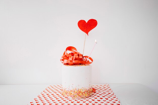 Gift box decorated with ribbon and heart