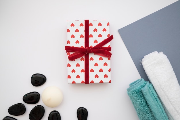 Free photo gift box, stones and towels