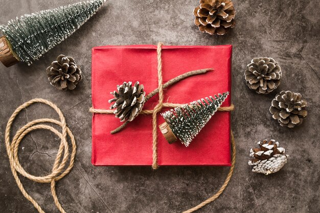 Gift box with cones on grey table