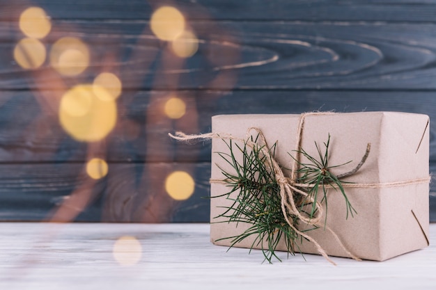 Gift box with fir tree branch