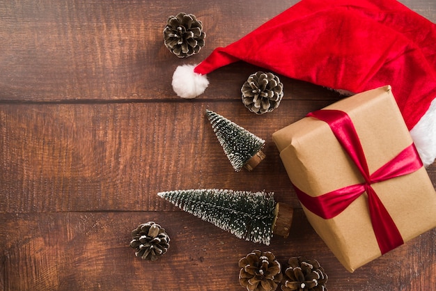 Free photo gift box with red ribbon and santa hat