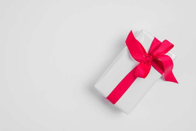 Gift box with red ribbon