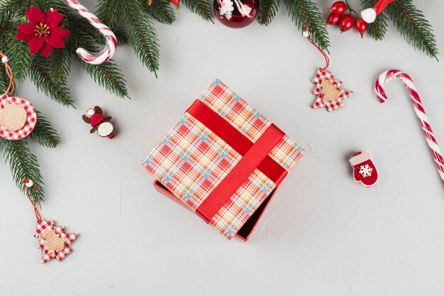 Gift box with small toys on table