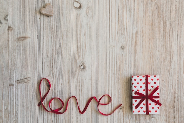 Gift box with the word "love" next to it