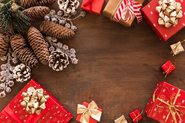 Gift boxes with big cones on table 