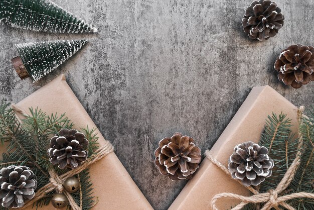 Gift boxes with green branches and cones