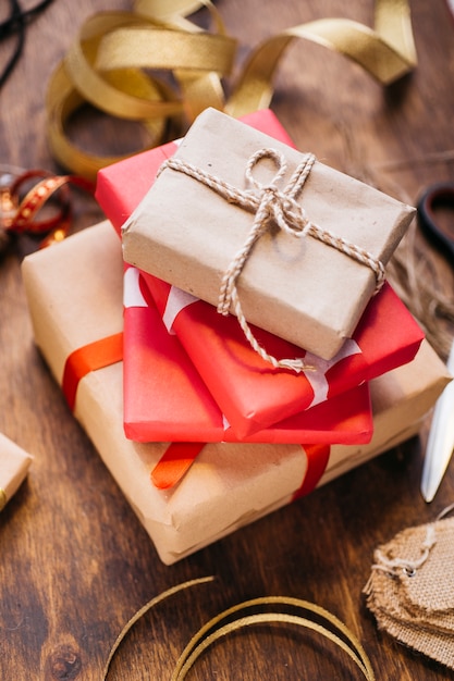 Gift boxes with ribbons on brown table