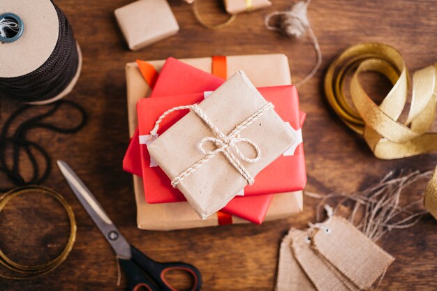 Gift boxes with ribbons on wooden table