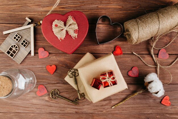 Gift boxes with small hearts on table