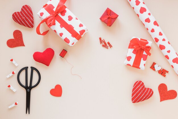 Gift boxes with wrapping paper on table