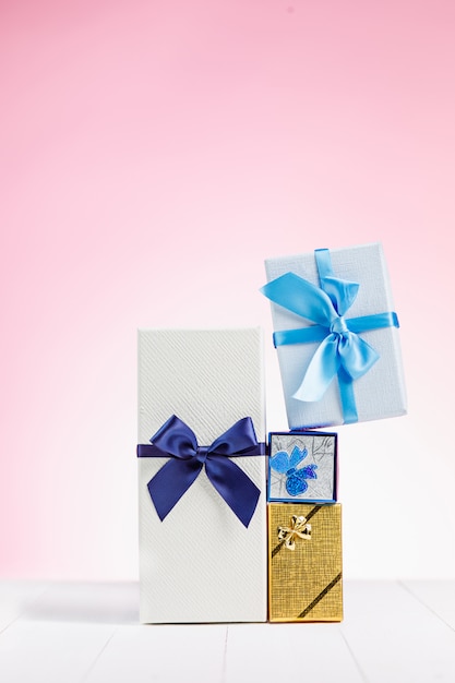 Gift boxes wrapped in recycled paper with ribbons and bows