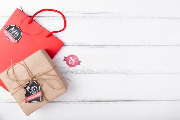 Gift and gift bag on wooden background with copy-space