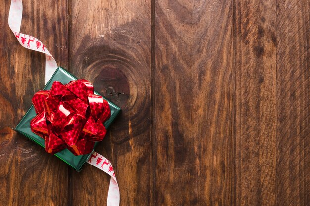 Gift lying on Christmas ribbon
