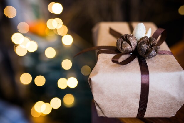 Gift with blurred christmas lights background