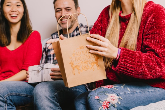 Gifting concept with woman holding shopping bag