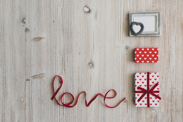 Gifts and a gray frame next to the word "love"