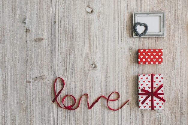 Gifts and a gray frame next to the word "love"