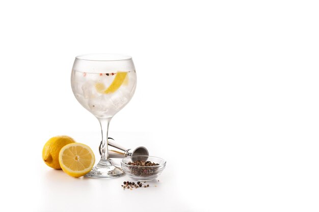 Gin tonic cocktail drink into a glass isolated on white background Copy space
