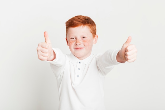 Ginger boy doing thumbs up