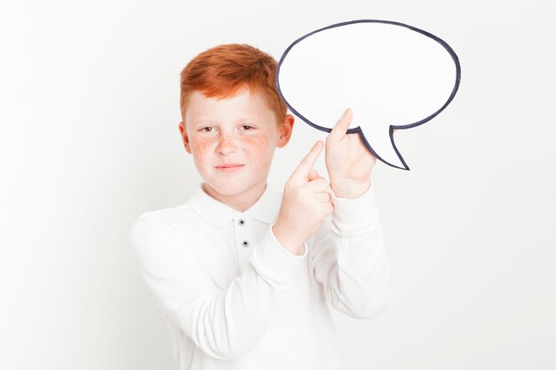 Ginger boy holding speech bubble