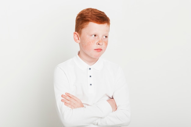 Ginger boy with arms crossed