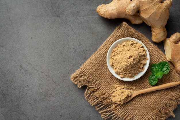 Free photo ginger root and ginger powder on table