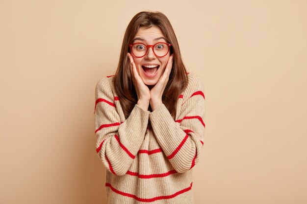 Ginger teenager wearing red eyeglasses