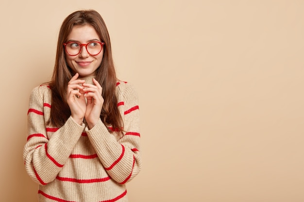 Ginger teenager wearing red eyeglasses