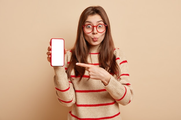 Ginger teenager wearing red eyeglasses