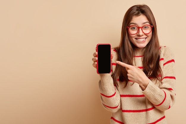 Ginger teenager wearing red eyeglasses