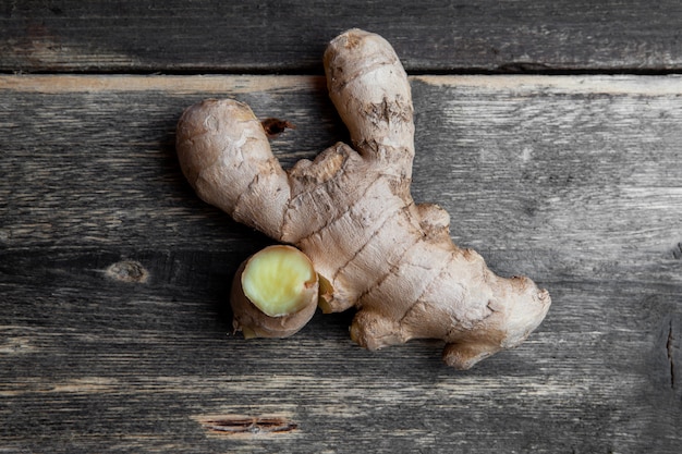 Ginger top view on a dark wooden background