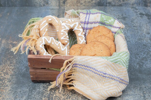 Gingerbread cookies and biscuits in wooden basket. High quality photo