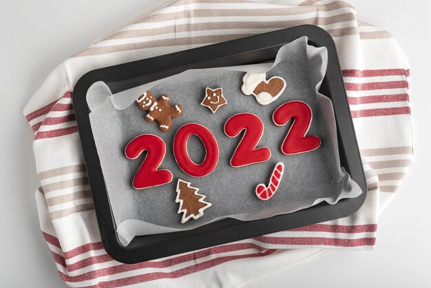 Premium Photo | Christmas Wreath And Inscription 2021 Gingerbread Cookie. Wooden Background. Close Up.