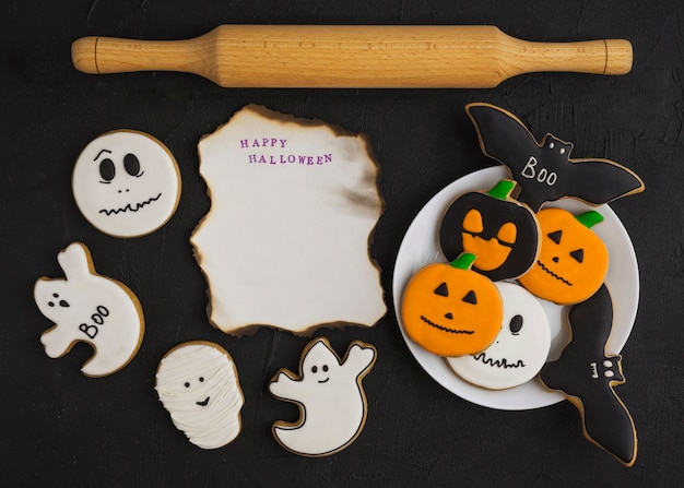 Gingerbread on plate near burning paper and plunger 